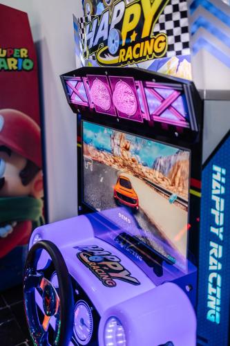 a toy racing arcade game with a toy car on it at Hotel Prestige Agadir Boutique & SPA in Agadir