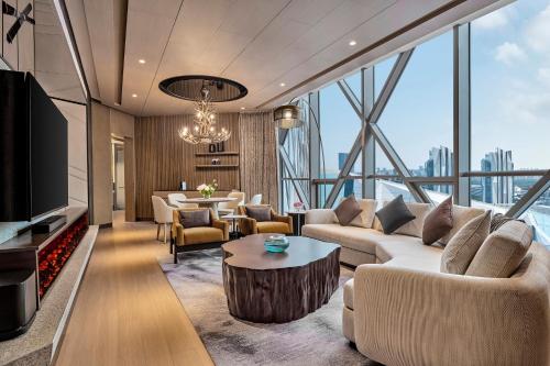 a living room with a couch and a table at Crowne Plaza Shanghai Snow World by IHG in Shanghai