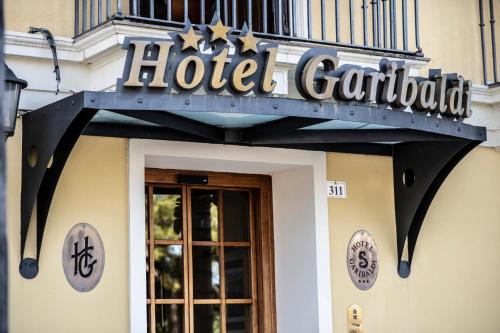 a hotel carillon sign on the side of a building at Hotel Garibaldi in Milazzo