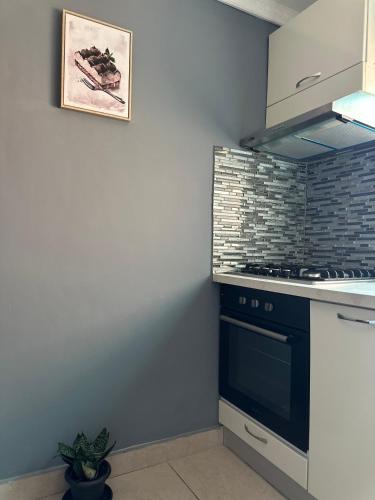 a kitchen with a stove and a counter top at Duende in Pointe-Noire