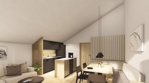 a kitchen and living room with a table and chairs at FRANZ alpine living - Apartments in Sankt Anton am Arlberg