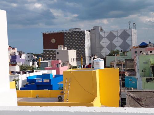 a view of a city with buildings in the background at VILLA DE VALENTIN home stay in Puducherry