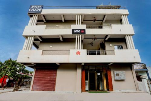 a building with an oop sign on the side of it at Hotel O Value in Jabalpur