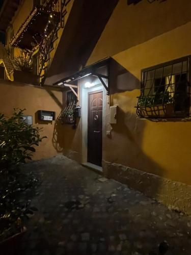 a hallway of a house with a door and a balcony at La Casetta di Andrea e Alessandra in Rocca di Papa