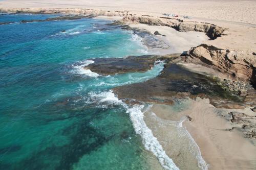 an aerial view of a beach and the ocean at MarVillaFuerte - Appart Air-Conditioned Swimming Pool & Private Jacuzzi in Villaverde