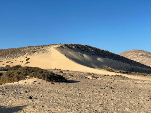 a sand dune in the middle of the desert at MarVillaFuerte - Appart Air-Conditioned Swimming Pool & Private Jacuzzi in Villaverde