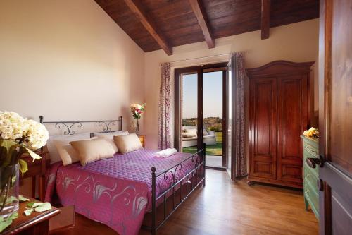 Ένα ή περισσότερα κρεβάτια σε δωμάτιο στο Le Orchidee Villa