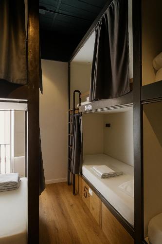 Katil atau katil-katil dalam bilik di Black Swan Hostel Sevilla