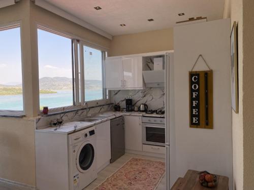 Kuchyň nebo kuchyňský kout v ubytování Stylish 2BR Apt Lagoon Views Beach