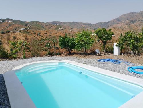 Swimmingpoolen hos eller tæt på Casa Rural Cuesta Málaga