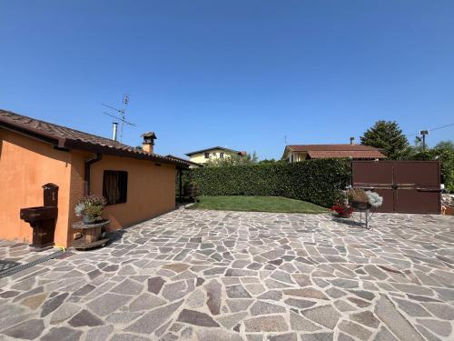 a stone patio in front of a house at Alloggio FELICE in Valmontone