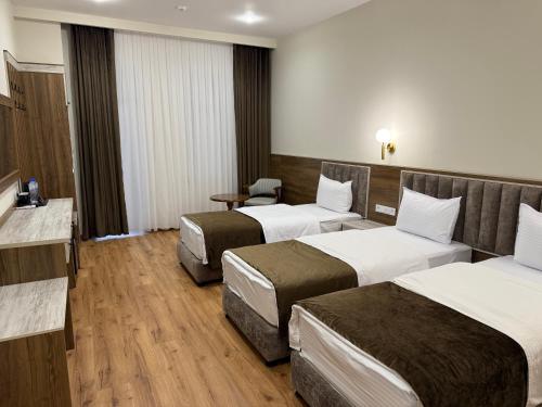 Кровать или кровати в номере Sabrina Hotel