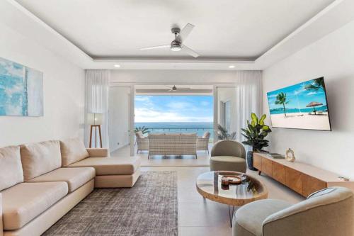 a living room with a couch and a table at Luxury Oceanview Condo with Pool in Tamarindo