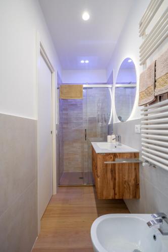 a bathroom with a sink and a shower at Azure apartments Amalfi Coast in Maiori
