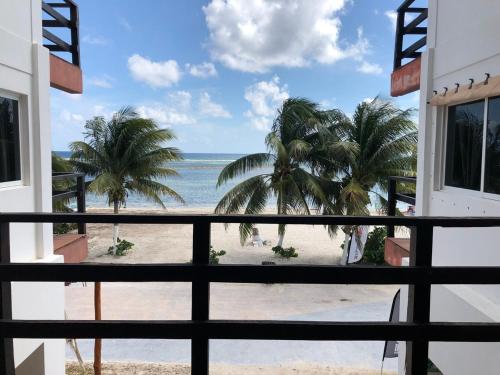 a view of the beach from the balcony of a house at Casa Atún Mahahual, vista al Mar Caribe in Mahahual