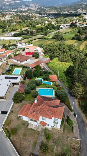 an aerial view of a group of houses andyards at Casa Maria Joana in Ponte de Lima