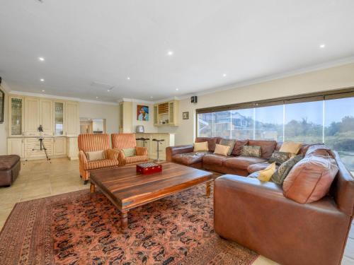 a living room with a couch and a coffee table at Seagull Villa in Margate