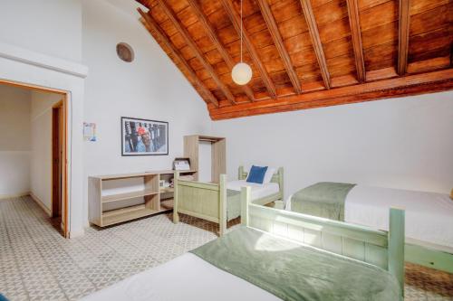 a bedroom with a bed and a desk at La Dominica Hotel Boutique in Cartagena de Indias