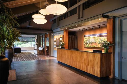 an office lobby with a reception desk and lights at Best Western Plus Hood River Inn in Hood River