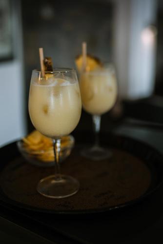 two cocktails sitting on top of a table at Peninsula Resort & Spa in Agia Pelagia