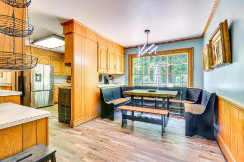 a kitchen with a table and a dining room at 2 Mi to Main St Thomasville Family Home with Games in Thomasville