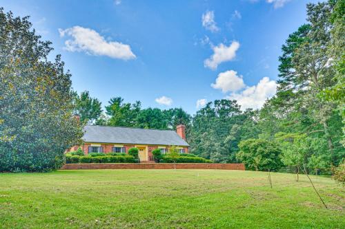 a house in the middle of a field at 2 Mi to Main St Thomasville Family Home with Games in Thomasville