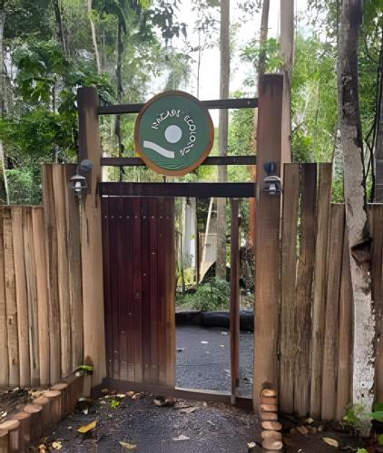 a wooden gate with a sign on top of it at Itacaré Ecolodge in Itacaré
