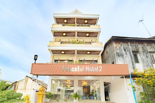 a building with a sign that reads cell at Peaceful 2 Hotel in Vientiane