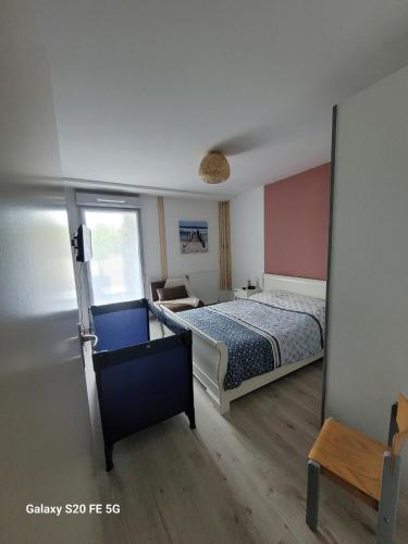 En eller flere senge i et værelse på Appartement