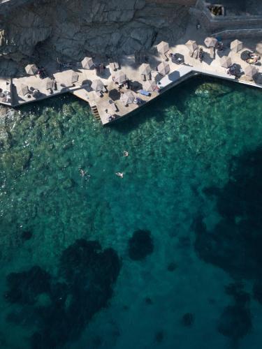 an aerial view of a pool of water at Peninsula Resort & Spa in Agia Pelagia