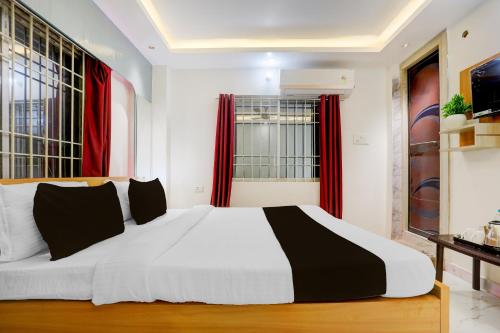Ένα ή περισσότερα κρεβάτια σε δωμάτιο στο Hotel O Sagar Luminoire Hotel & Banquet Hall