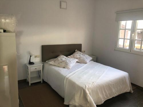 Postel nebo postele na pokoji v ubytování Cafú Casita