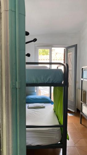 a couple of bunk beds in a room at Can Cocollona in Girona