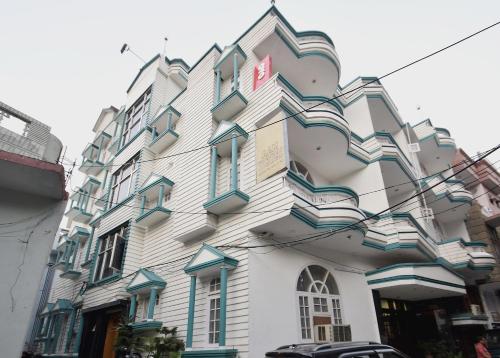 a building with blue and white at Super Hotel O Maa Residency in Jammu