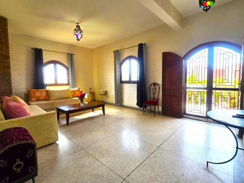 a living room with a couch and a table at Dar Abaraz in Taroudant