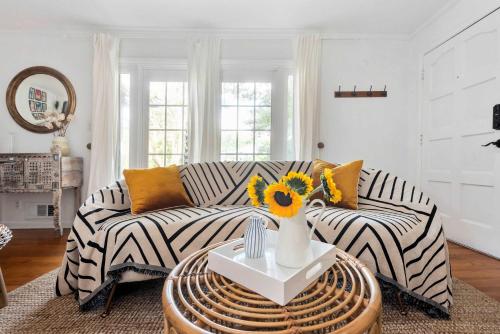 a living room with a zebra couch and a table at Joshua Tree in Atlanta