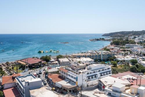 an aerial view of a city and the ocean at Ermou 44 City Hotel in Faliraki