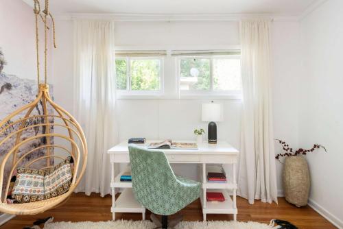 a room with a desk with a chair and a swing at Joshua Tree in Atlanta