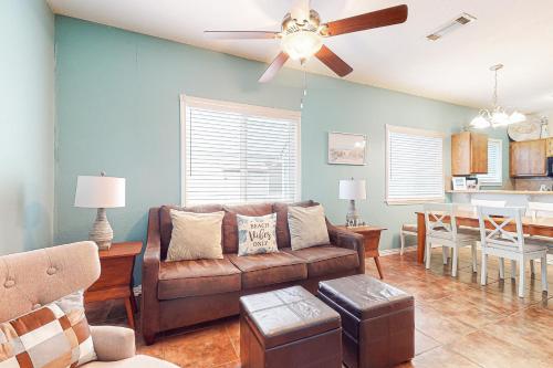 a living room with a couch and a dining room at Lyla's Beach Getaway in Padre Island