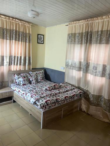 Postel nebo postele na pokoji v ubytování Peace Apartment