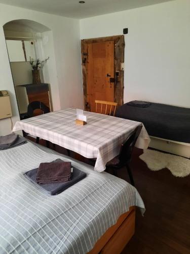 a room with two beds and a mirror at Gorshof in Spital am Pyhrn
