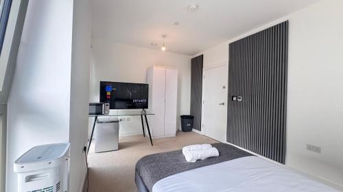 Ένα ή περισσότερα κρεβάτια σε δωμάτιο στο Riverside Rooms and Apartments
