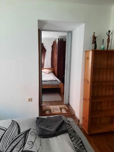 a bedroom with a mirror and a bed and a dresser at Gorshof in Spital am Pyhrn
