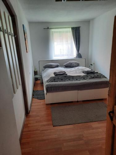 a small bedroom with a bed and a window at Gorshof in Spital am Pyhrn