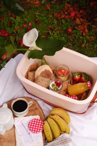 a container filled with different types of food and fruit at Villa Várzea - Garden Suite in Várzea