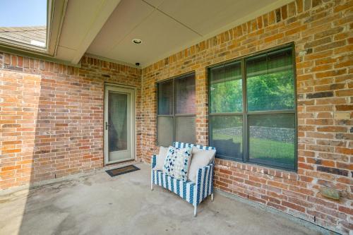 a chair sitting in front of a brick wall at Spacious Texas Retreat with Community Pool in Sunnyvale