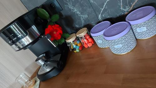 a coffee machine sitting on top of a wooden table at Dream cube & Spa in Coutevroult
