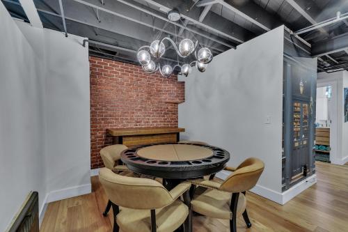 a dining room with a table and chairs at The Chateau de James by Granger Gardens in Ann Arbor