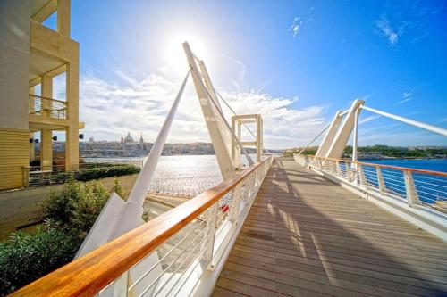 a bridge over a body of water at Stay Charles Sliema Home, Cozy, Prime Spot, Near Seafront in Sliema