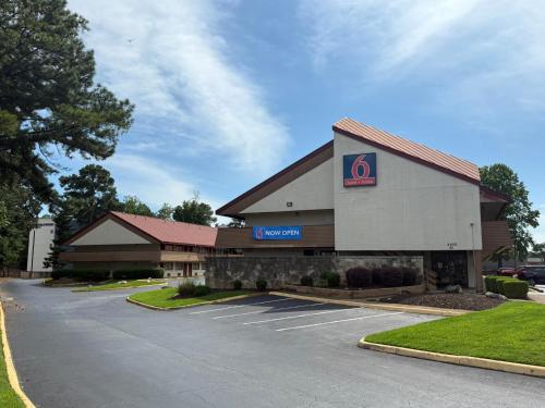 a building with a sign in a parking lot at Motel 6 Smyrna, GA in Atlanta